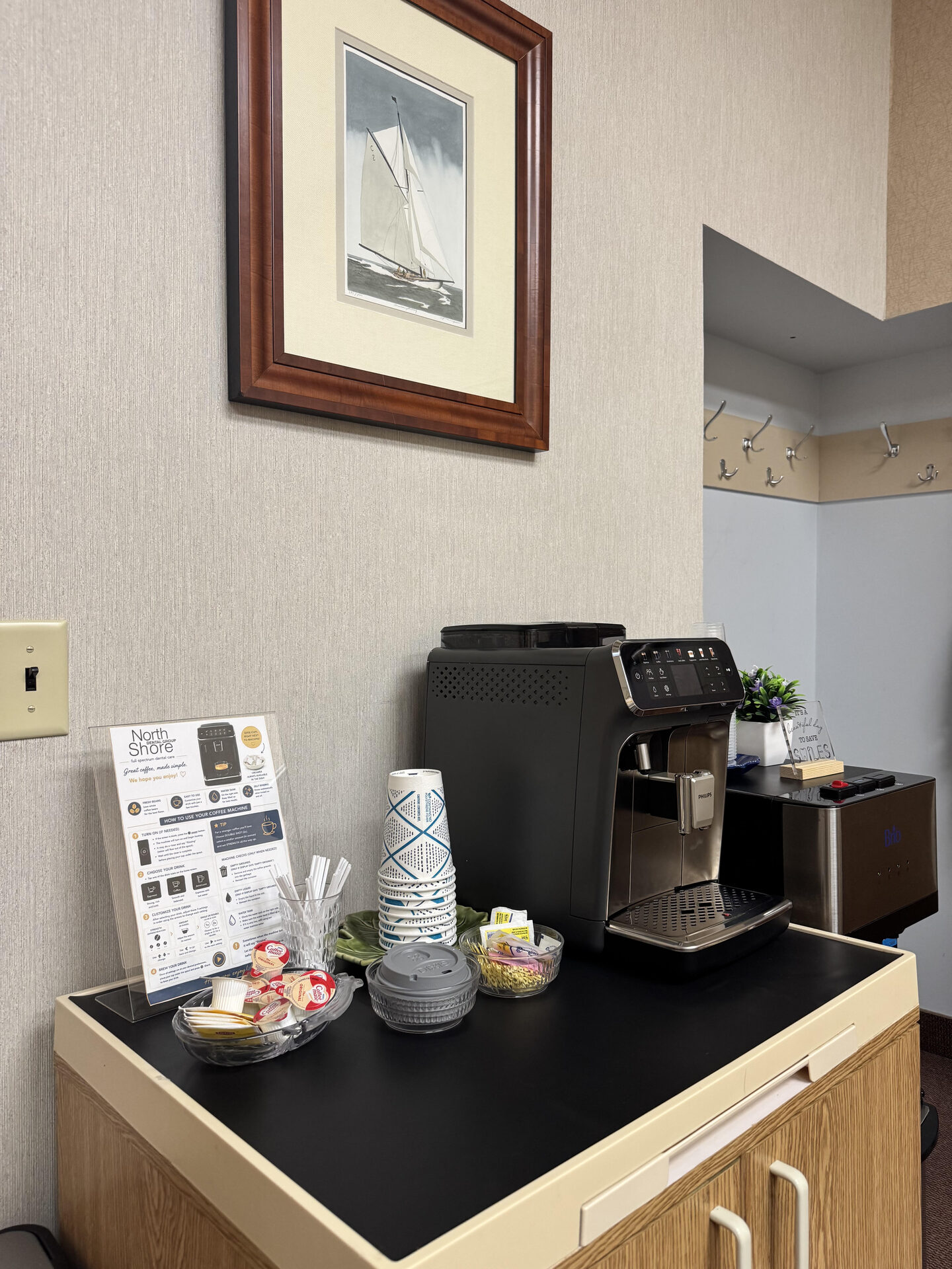 Complimentary coffee and refreshment station in the reception area at North Shore Dental Group