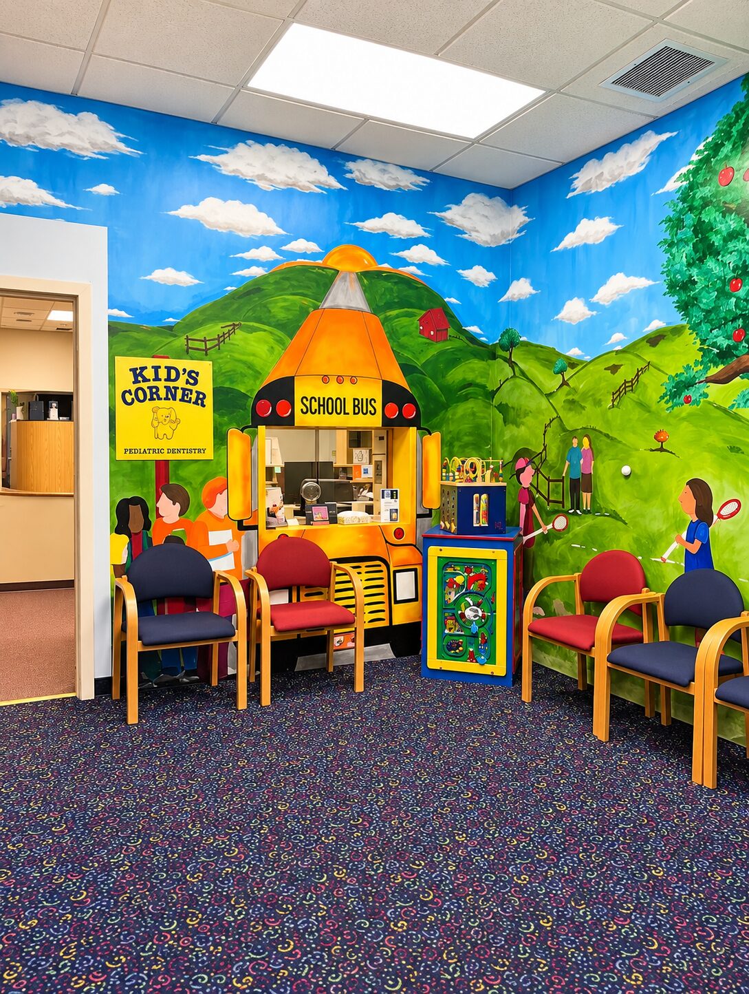 Kids' Corner play and waiting area with hand-painted murals at North Shore Dental Group